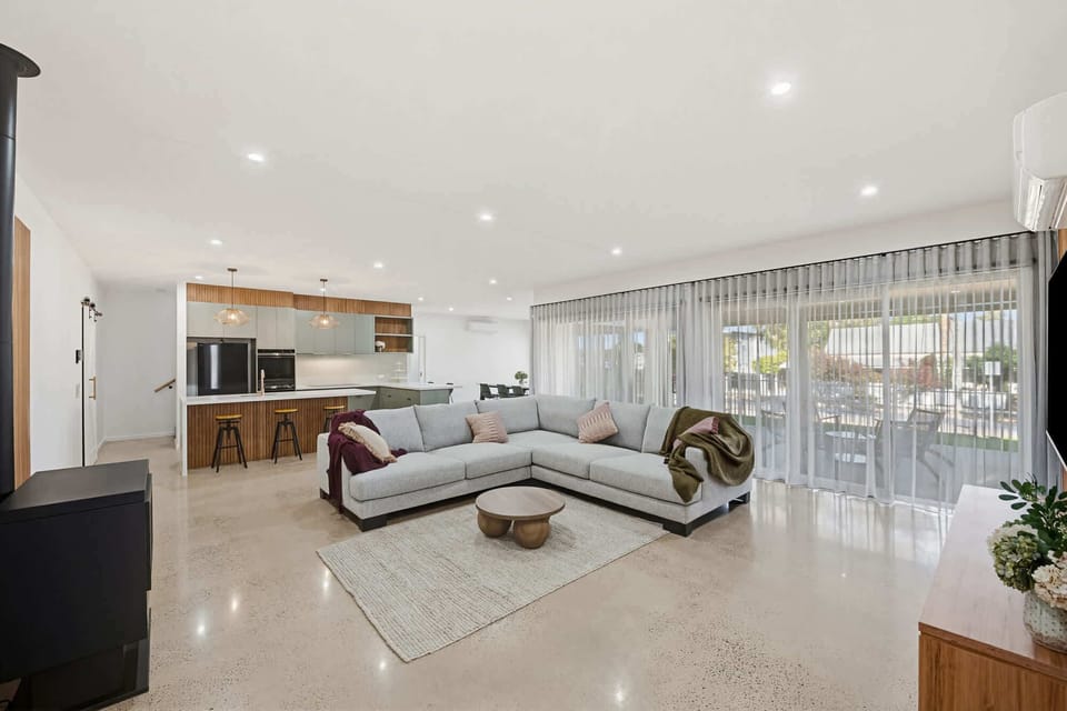 Large open plan living, dining and kitchen area.