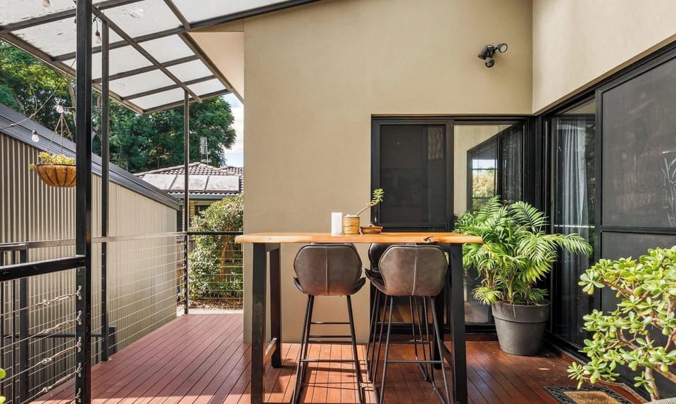 High table on back deck over looking back yard. Smoking is also allowed in this area