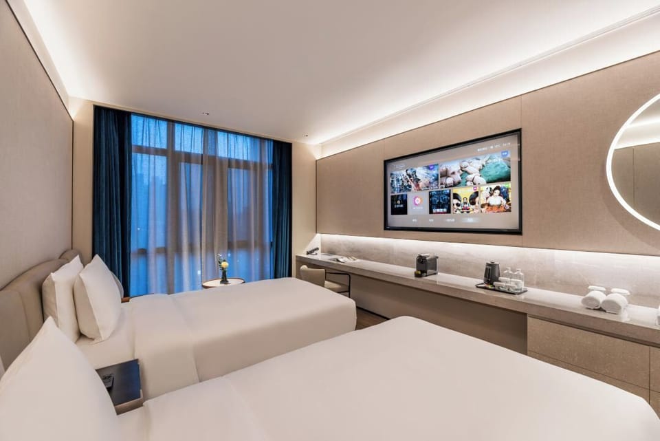 Deluxe Twin Room, City View | Hypo-allergenic bedding, memory foam beds, free minibar, blackout drapes