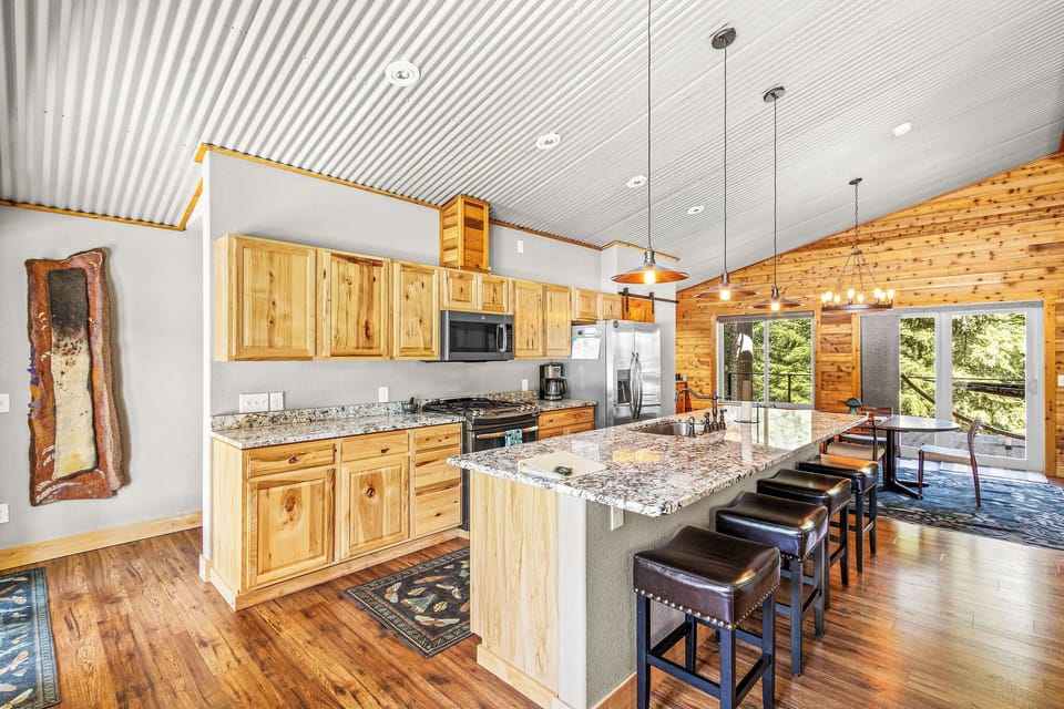 Kitchen opens to dining room and living room. Access to front and back balconies