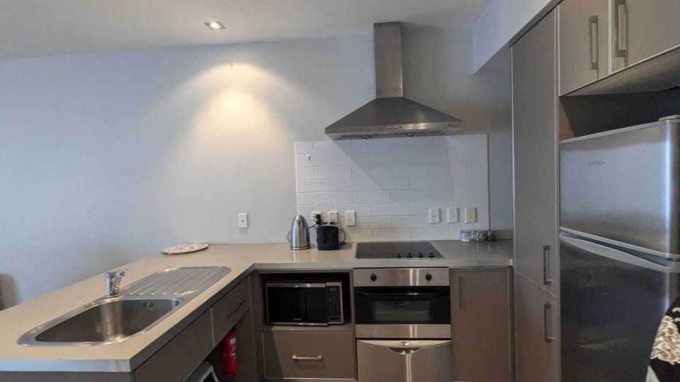 Deluxe Apartment, Patio, Ocean View | Private kitchen | Full-size fridge, microwave, oven, stovetop