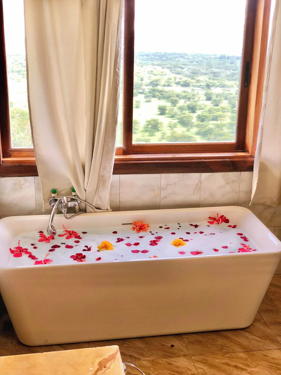 Combined shower/tub, hair dryer, slippers, towels