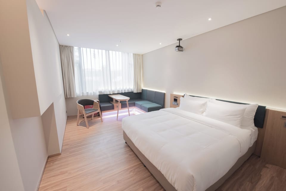 Premium bedding, down comforters, memory foam beds, free minibar