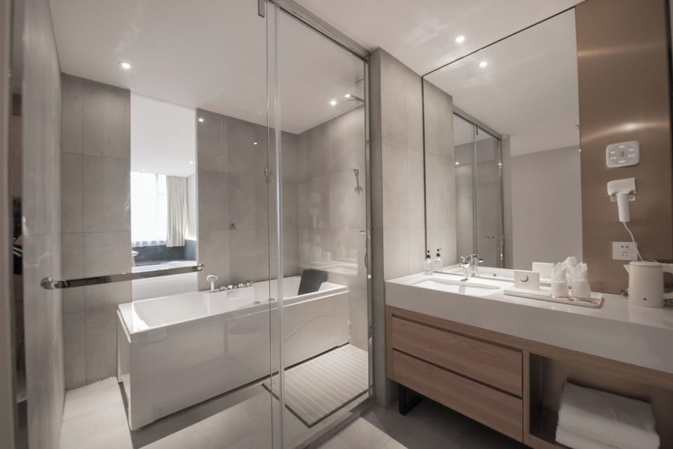Premier Room, 1 Bedroom, Housekeeping, City View | Bathroom | Shower, hydromassage showerhead, designer toiletries, hair dryer