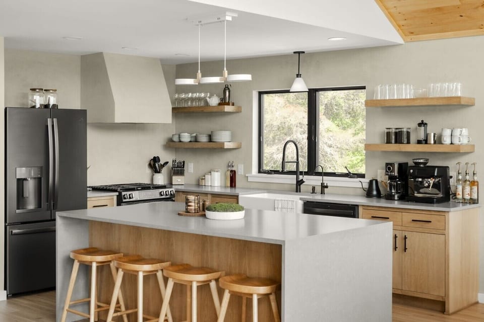 modern design with everyday functionality, featuring stainless steel appliances, spacious countertops, and a large island perfect for gathering