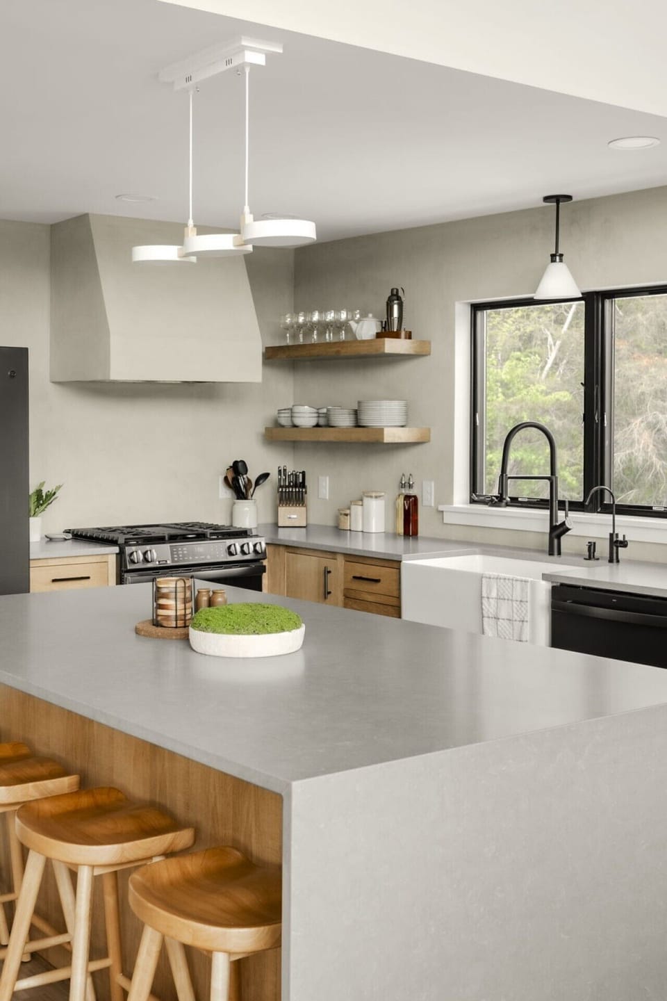 modern design with everyday functionality, featuring stainless steel appliances, spacious countertops, and a large island perfect for gathering