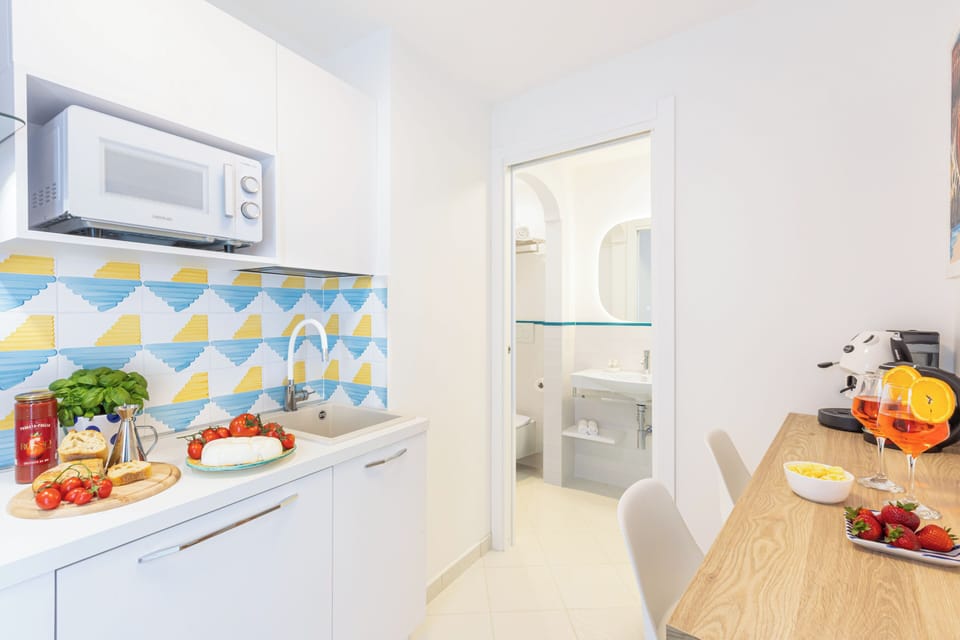 Deluxe Apartment, Sea View | Private kitchen | Mini-fridge, microwave, stovetop, espresso maker