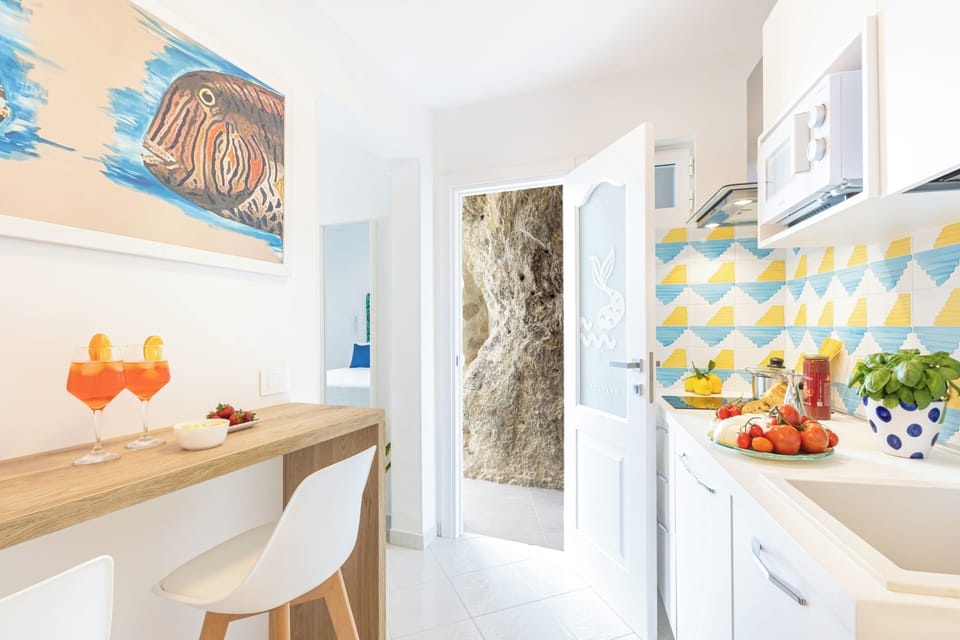 Deluxe Apartment, Sea View | Private kitchen | Mini-fridge, microwave, stovetop, espresso maker