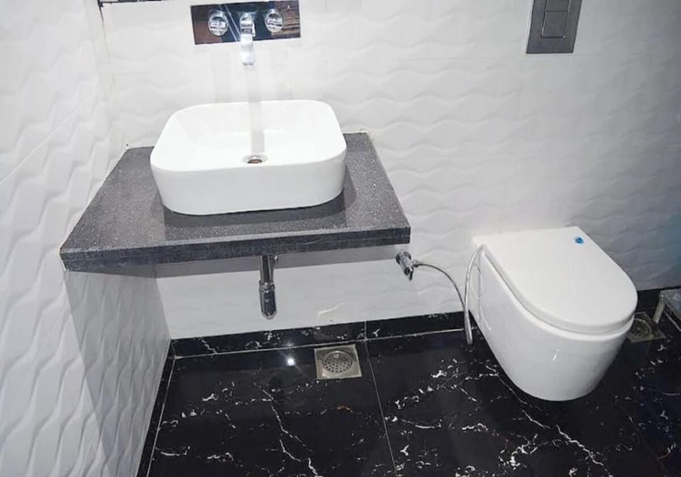 Shower, towels, soap, toilet paper