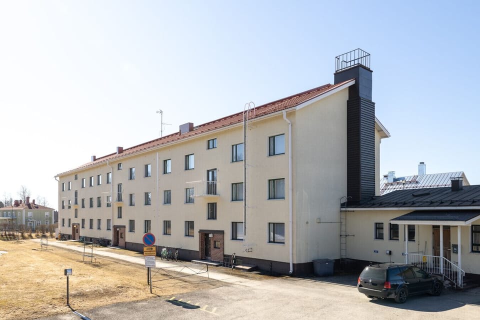 A view of the quiet residential street and the building`s exterior.