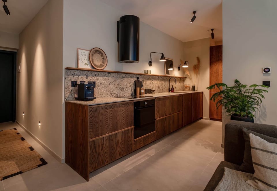 A beautifully designed kitchen where warm textures and modern finishes create the perfect space to cook and unwind.