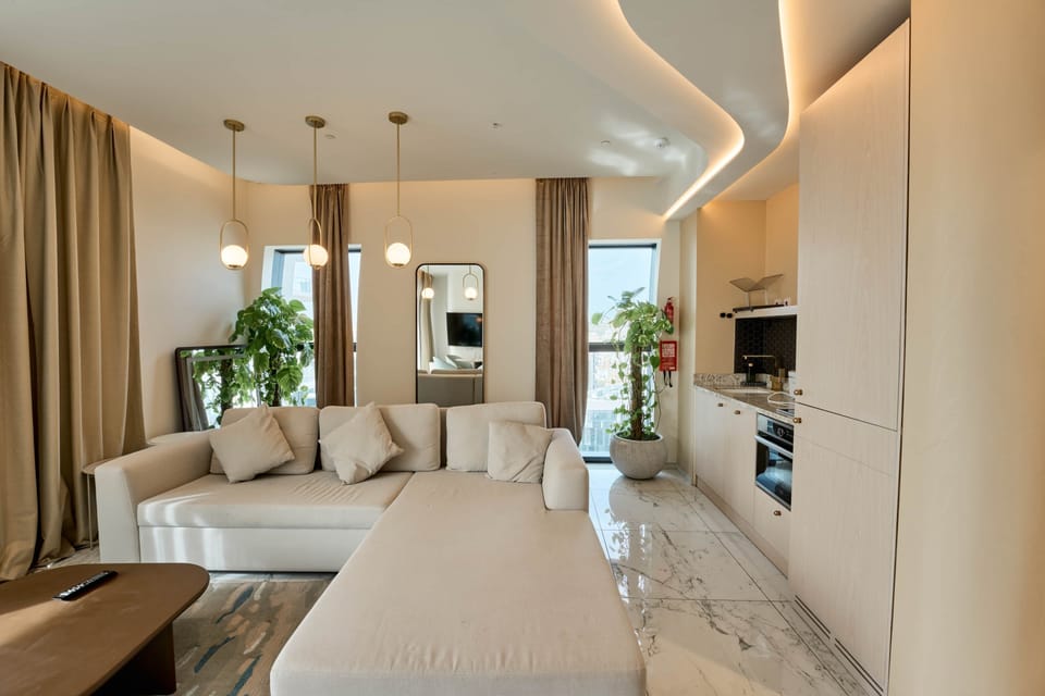 Stylish Living Room with Designer Lighting and Kitchenette