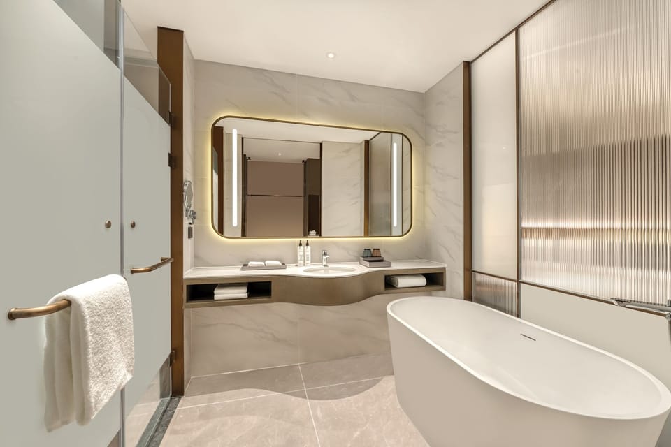 Comfort Room | Bathroom | Hair dryer, towels, shampoo, toilet paper