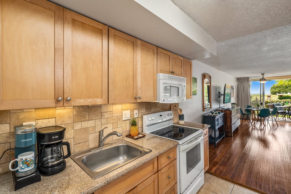 Fully equipped kitchen with warm wood cabinetry and everything you need for easy meal prep.