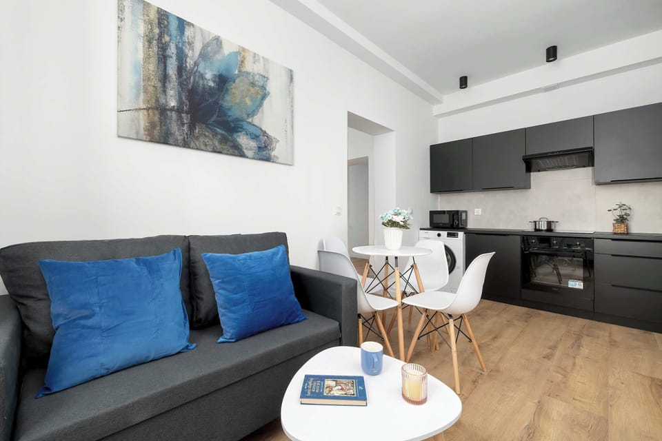 The living room has a modern look and comfortable furniture.
