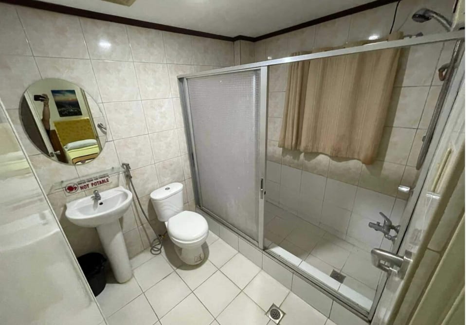 Shower, free toiletries, slippers, towels