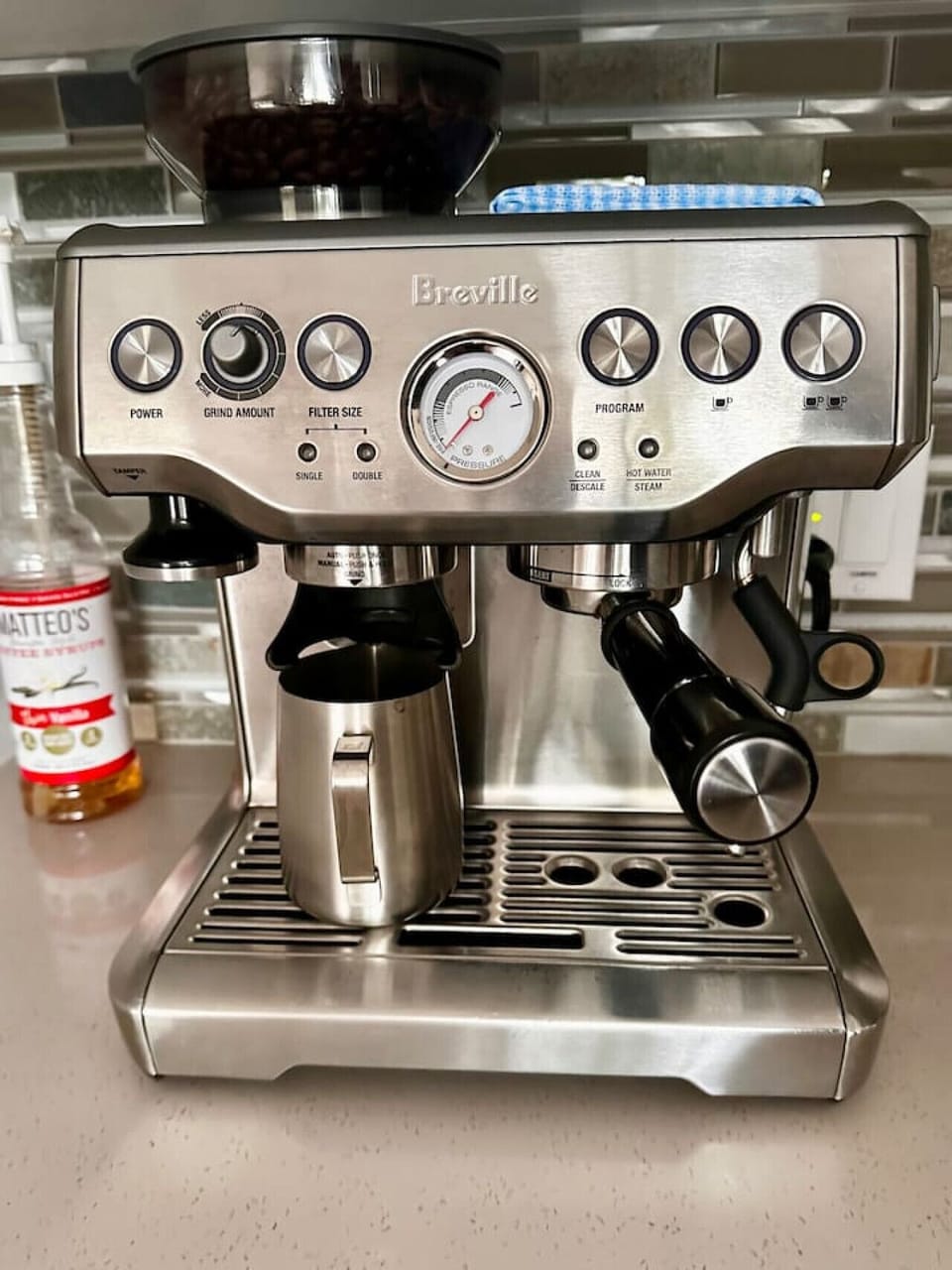 Breville Espresso Machine with coffee grinder.