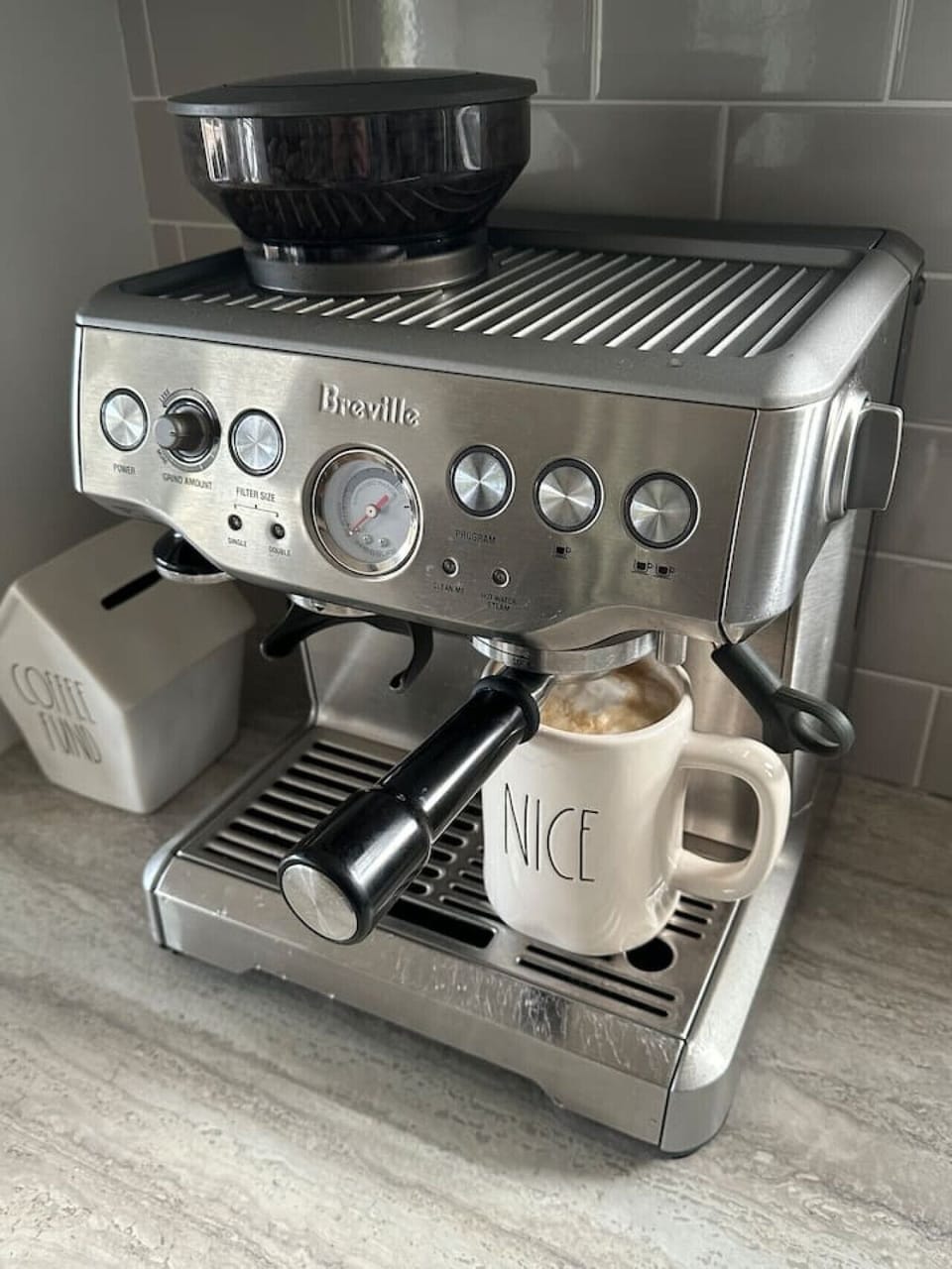 Breville Espresso Machine with coffee grinder.