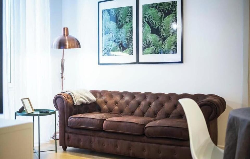 Deluxe Apartment, Balcony, City View | Living area | Flat-screen TV, DVD player