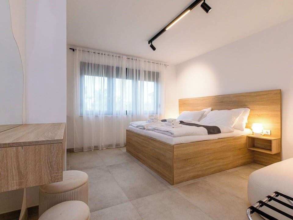 Bed, Interior Design, Furniture, Floor, Flooring, Bedroom, Wall, Wood, Room, Ceiling