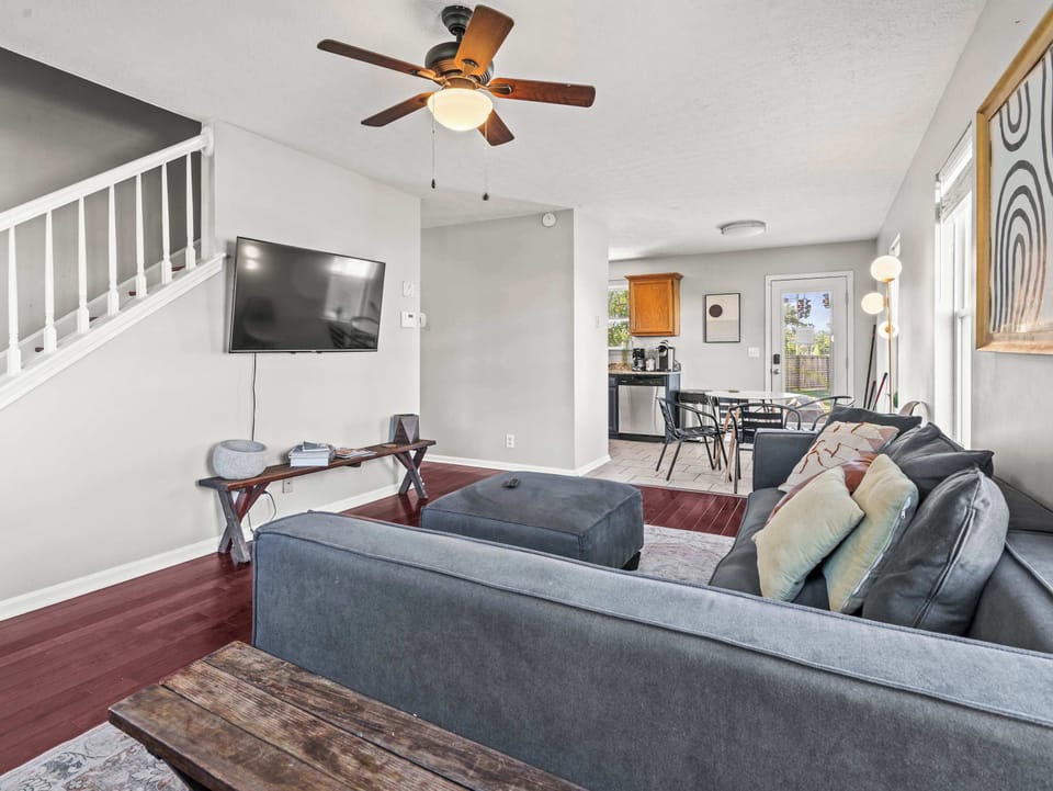 Living Room: Bright and inviting living room with cozy seating, warm natural light, and a relaxing space perfect for movie nights or unwinding after a day of exploring.