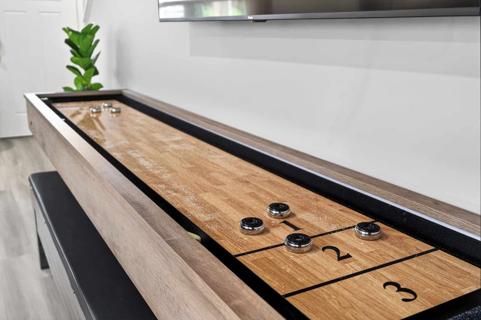 Living Room: Enjoy the best of both worlds with a cozy living area and dedicated game space, ideal for movie nights, friendly competition, and family fun.