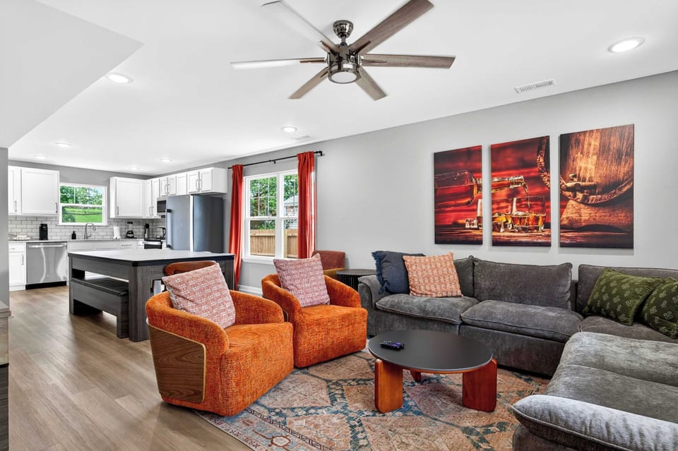 Living Room 1: Unit A features a bright and welcoming living room with comfortable seating, a smart TV, and plenty of space to relax after a day of work, travel, or exploring.
