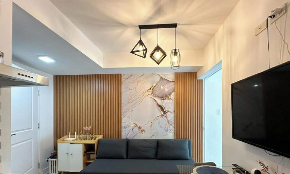 Family Condo, Balcony, City View | Living area | 110-cm Smart TV with digital channels