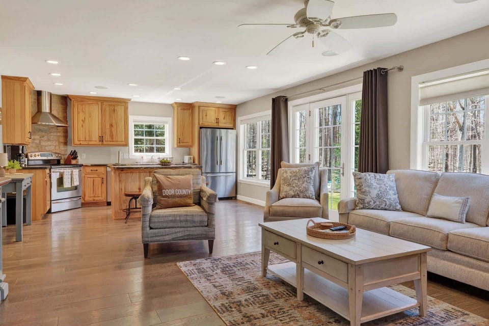 Relax in your bright open living space where comfortable seating meets a fully equipped kitchen, perfect for memorable gatherings.