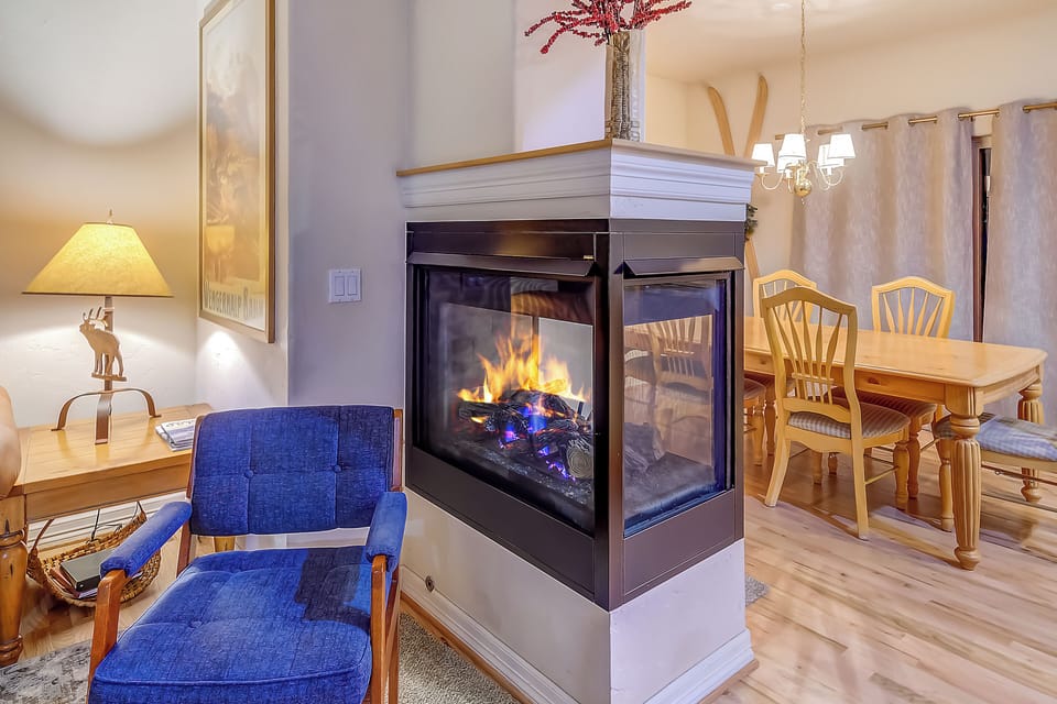 Gas Fireplace Divides Living Room and Dining Room