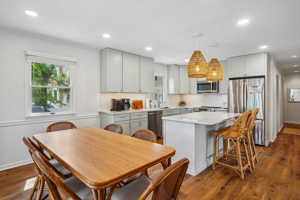 Your spacious, light-filled kitchen invites you to gather around the island or dining table, blending modern appliances with warm coastal charm for effortless meal prep and conversation.