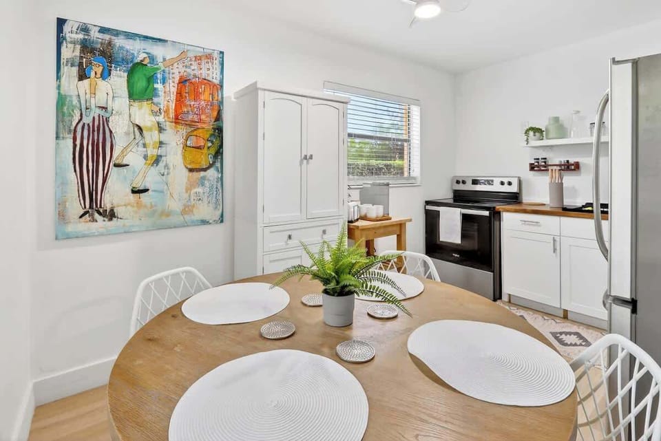 Comfortable dining table for four, ideal for meals, work, or planning your day.