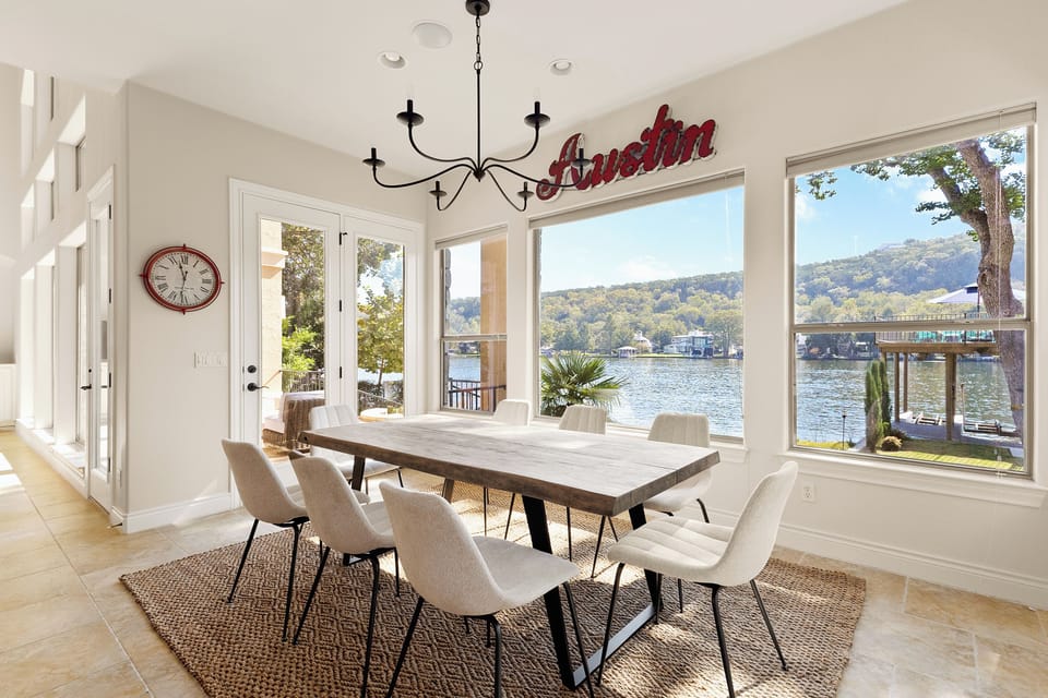 Lake-view dining room seats eight beneath the Austin sign