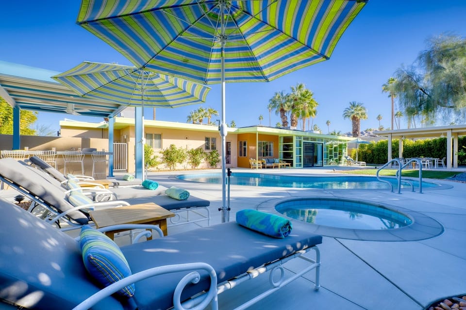 Beautifully renovated backyard with pool, spa, outdoor kitchen and dining area. 