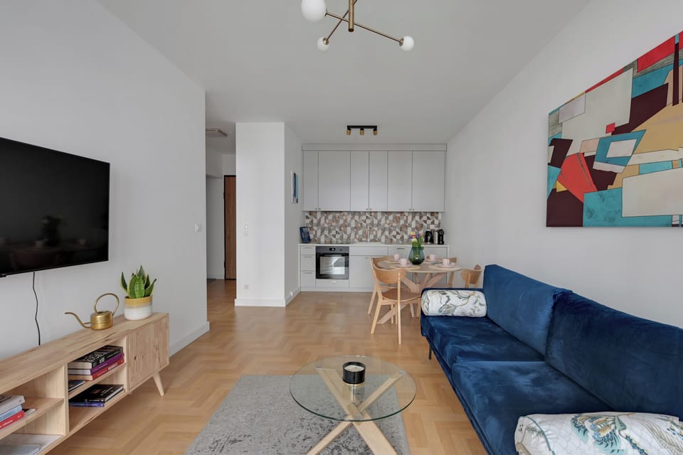 Deluxe Apartment | Living area | Flat-screen TV