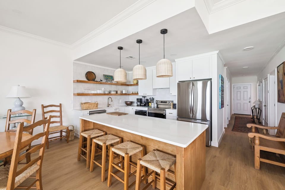 Your bright, open kitchen invites you to gather around the island while morning coffee brews and conversations flow naturally.