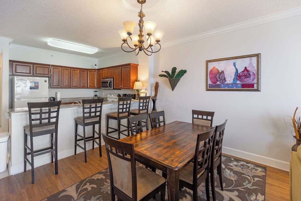 Gather around your spacious dining table for memorable meals with family and friends in this elegant open-concept space.
