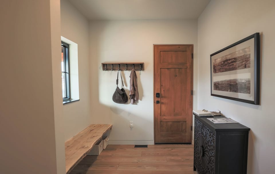 Ample Foyer opposite Laundry Room designed to launch your outdoor adventures.