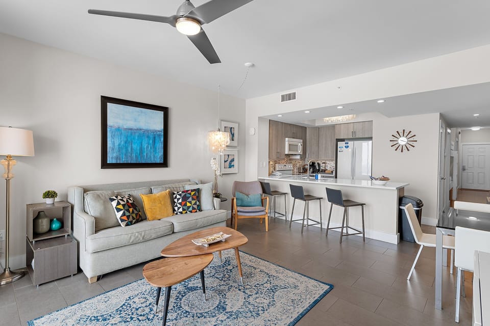 Spacious living area with plenty of seating, sleeper sofa, 65" Smart TV, relax while enjoying those incredible GULF VIEWS!