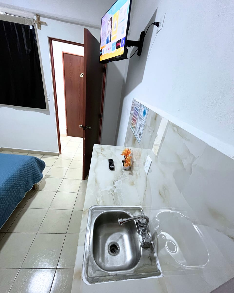 Basic Room, 1 Queen Bed | Private kitchen | Full-size fridge