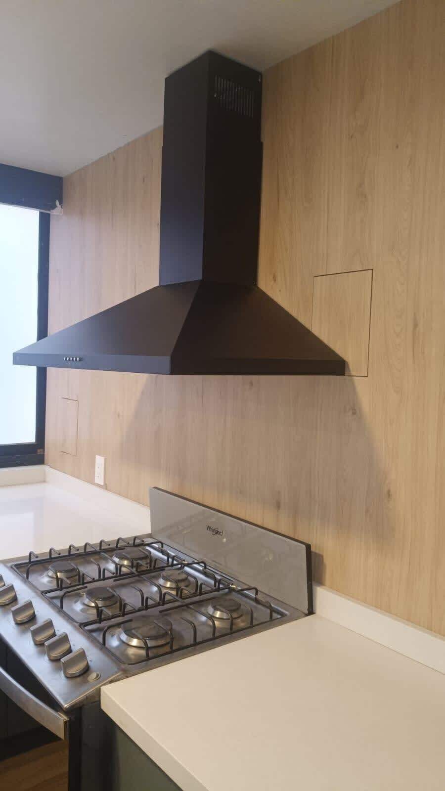 Chef-ready gas range with a sleek vent hood, making it easy to cook up your favorite meals during your stay