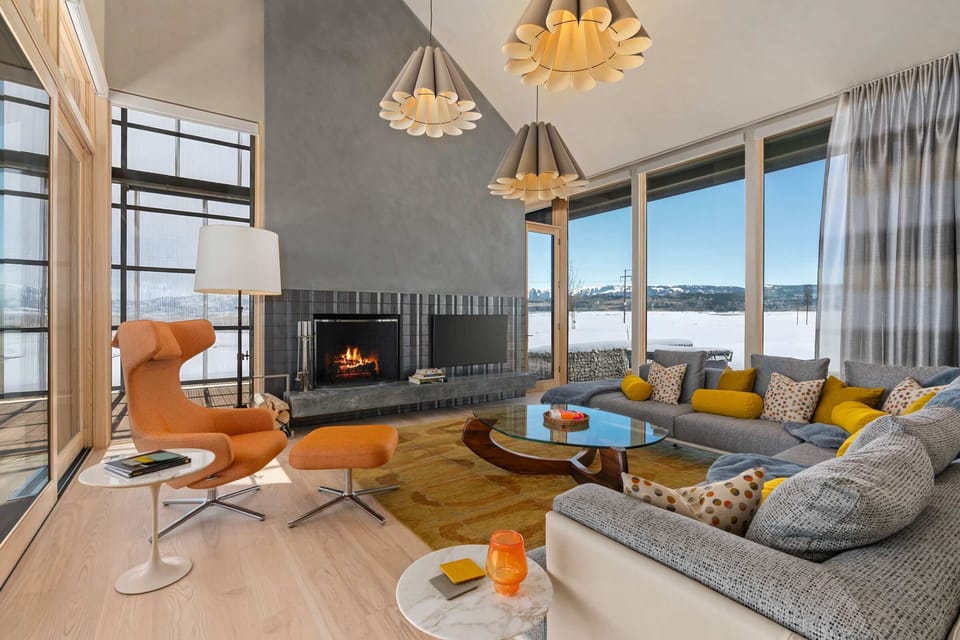 Bold mid-century modern decor accentuates the light & bright living room.