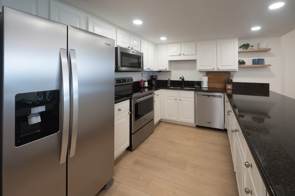Well-equipped open-concept kitchen overlooking the living and dining room, designed for guests who love to cook. Pick up fresh seafood from Local Steamer Seafood Market and enjoy family meals together after a day relaxing at Panama City Beach.