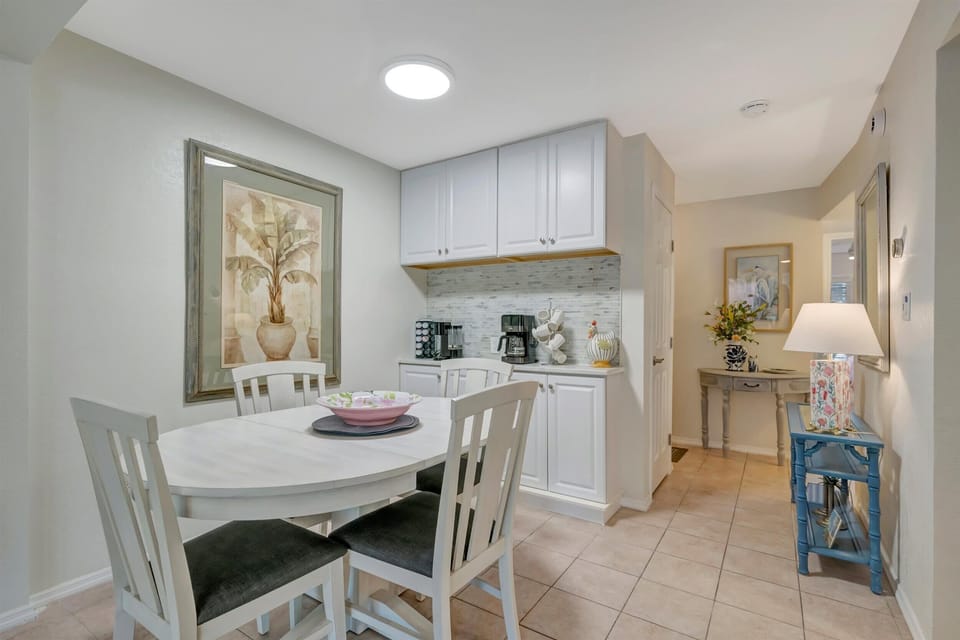 Open dining near kitchen and entryway