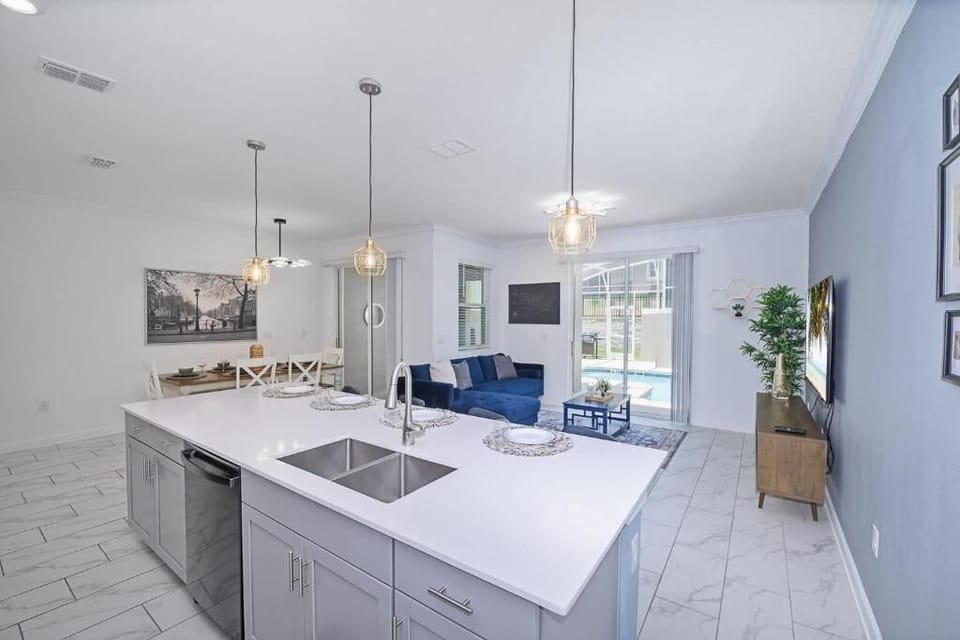 Open kitchen island flowing into living room