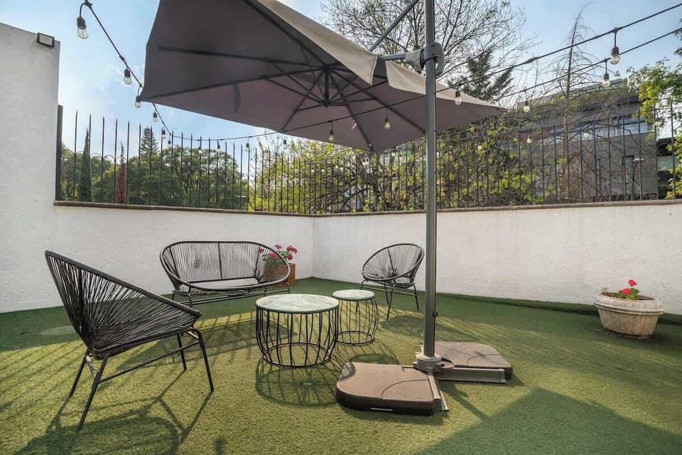 A lovely area outside with Acapulco style chairs.