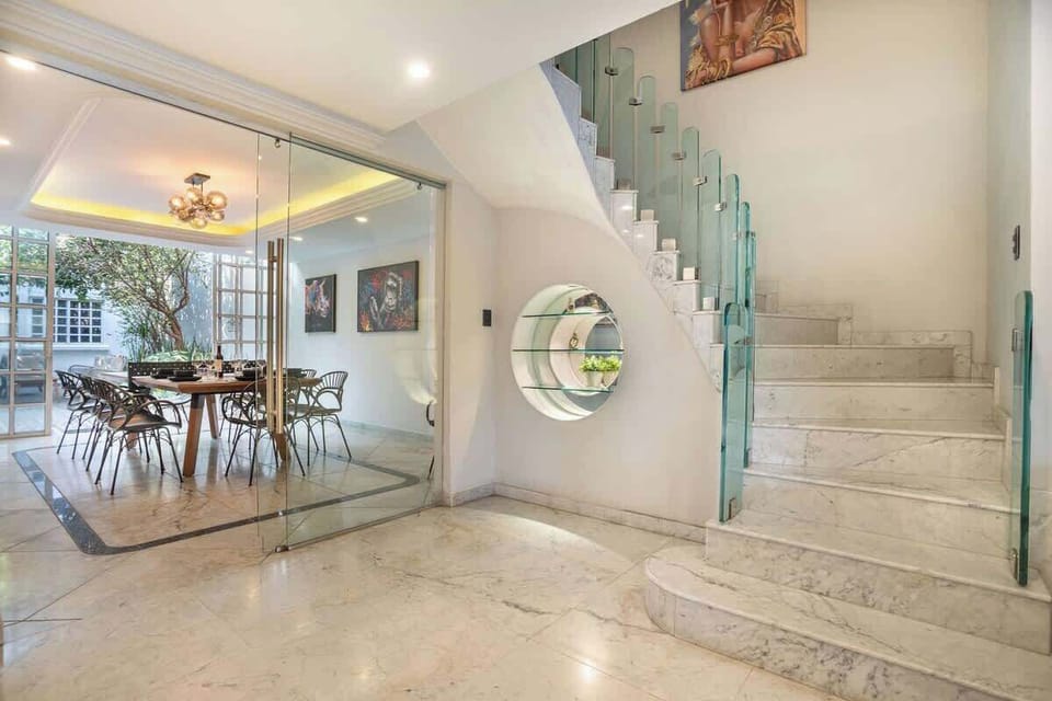 An open central space connecting dining areas and upper floors.