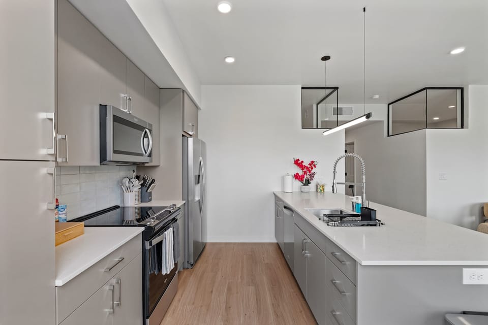 Spacious kitchen with full appliances and breakfast bar seating, perfect for cooking, entertaining, and everyday comfort
