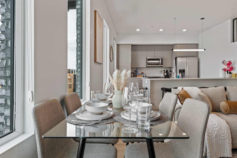 Open concept living and dining space with mountain views, cozy seating, and modern design, perfect for relaxing and gathering
