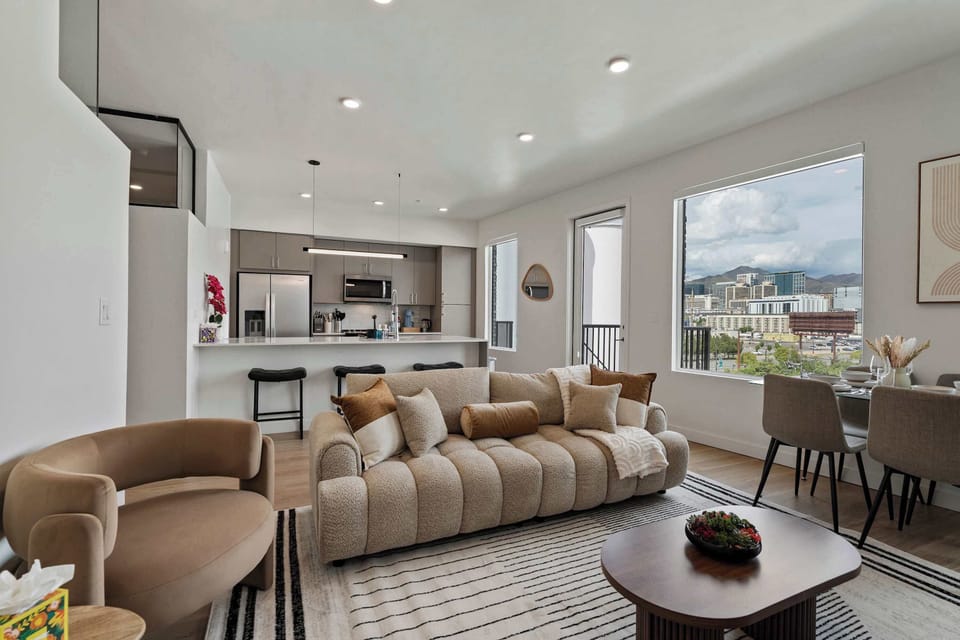 Relax in a Spacious Living Room with a Comfy Sofa, Plenty of Seating, and Movie Night Comfort